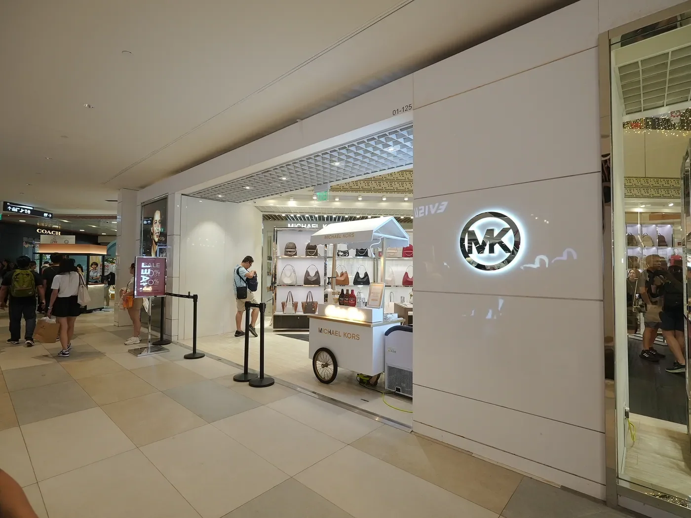 Michael Kors storefront with a branded gelato cart