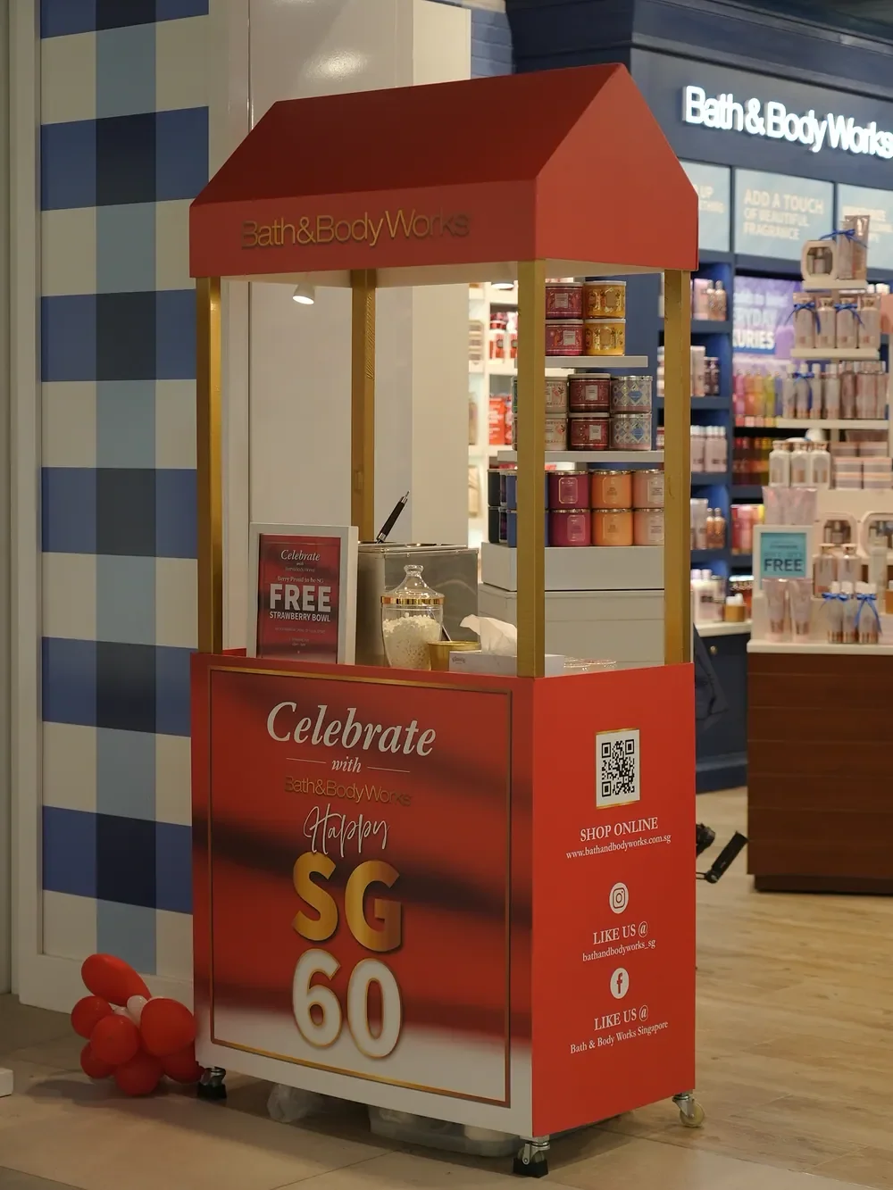 Red and gold Bath & Body Works SG60 strawberry-bowl cart