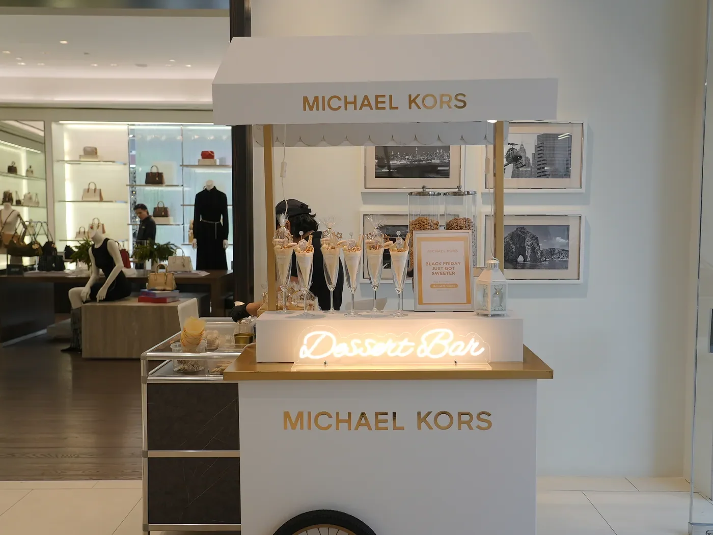 White Michael Kors Dessert Bar cart in the retail space